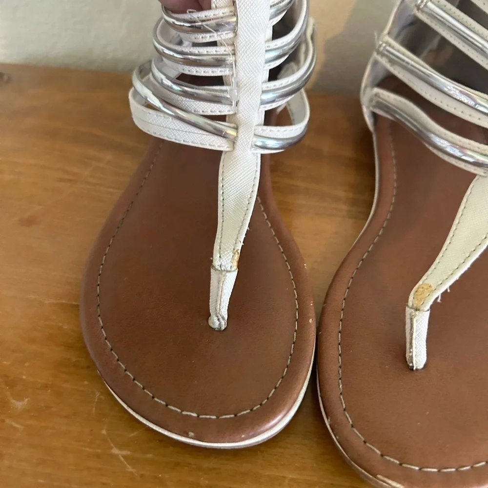 Youth size, one justice, gladiator, white, and silver sandals